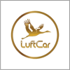 A gold crane flying above the text LuftCar, all enclosed in a gold circle on a white background.