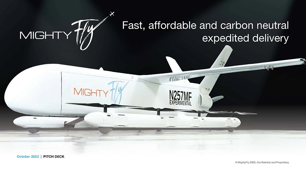 A white cargo drone labelled MightyFly with text promoting fast, affordable, carbon-neutral delivery on a light background.