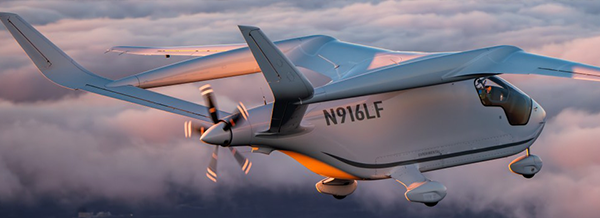 A futuristic electric aeroplane with the registration N916LF flies above the clouds during sunset.